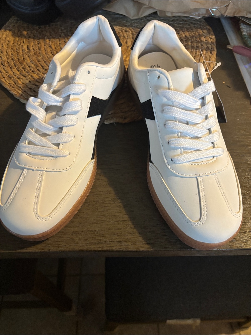 Women’s gum sole sneakers with memory foam insert.